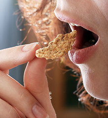 Image showing Young people eating milk with cereals