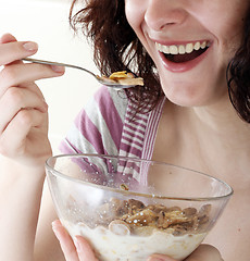 Image showing Young people eating milk with cereals