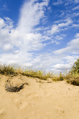 Image showing Sand dunes under a nice clouded sky