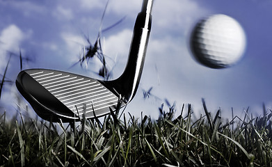 Image showing Golf club and ball in grass