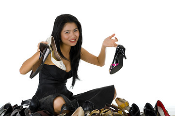 Image showing beautiful woman sitting with her shoes