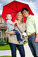 Image showing Happy family with umbrella