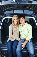 Image showing Couple sitting in back of car