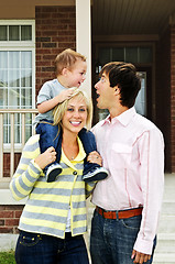 Image showing Happy family in front of home