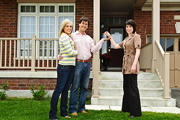 Image showing Happy couple with real estate agent