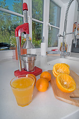 Image showing Oranges on red modern kitchen