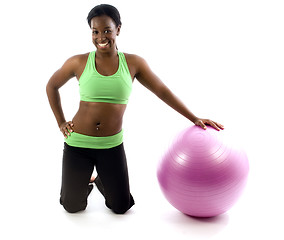 Image showing young pretty hispanic african american woman exercising with fit