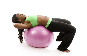 Image showing young pretty hispanic african american woman exercising with fit