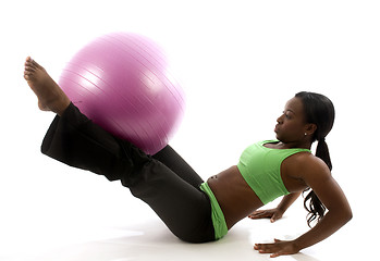 Image showing young pretty hispanic african american woman exercising with fit