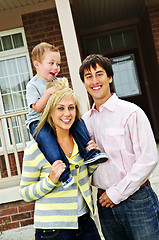 Image showing Happy family in front of home