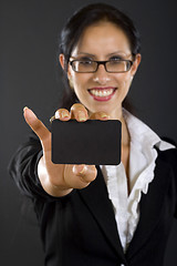 Image showing closeup of an attractive businesswoman presenting a card