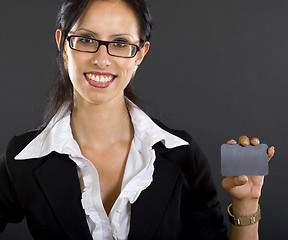 Image showing picture of an attractive businesswoman presenting a blank card