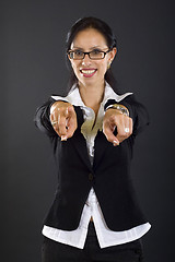 Image showing attractive businesswoman pointing to you with both hands