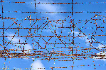 Image showing barbed wire blue sky