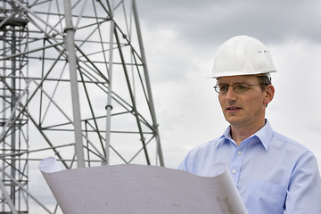 Image showing Engineer reading a plan