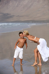 Image showing Mother and son on the beach