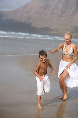 Image showing Happy Mother and son on the beach