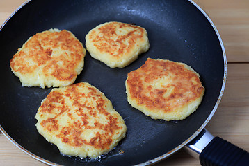 Image showing Frying potato pancakes