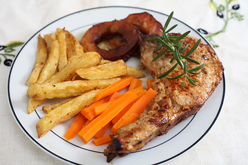 Image showing Pork chop cooked in wine with apples