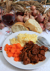 Image showing Boeuf bourguignonne meal with wine and bread