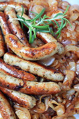 Image showing Fried sausage and onions