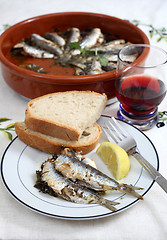 Image showing Fresh baked sardines vertical