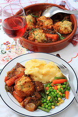 Image showing Beef stew and serving bowl vertical