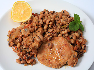 Image showing Pork and beans meal horizontal