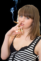 Image showing Portrait of the young woman with a cigar. Isolated