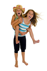 Image showing playful young naughty sisters having fun