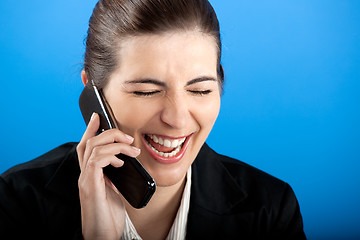 Image showing happy businesswoman calling at phone