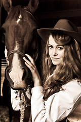 Image showing Beautiful girl with her horse