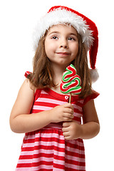 Image showing Pretty santa girl with christmas lollipop