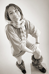 Image showing young happy woman in striped muffler