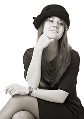 Image showing smiling young woman in black hat