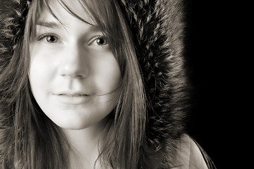 Image showing serious young woman in fur hat