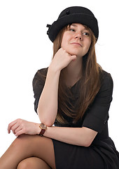 Image showing smiling young woman in black hat