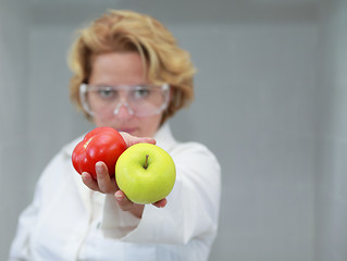 Image showing Female scientist offering natural food