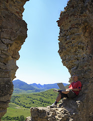 Image showing Working on a laptop