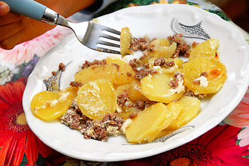 Image showing Baked potatoes with meat in plate
