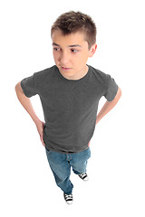 Image showing Boy in grey t-shirt and blue jeans