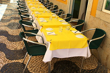 Image showing empty tables in street cafe