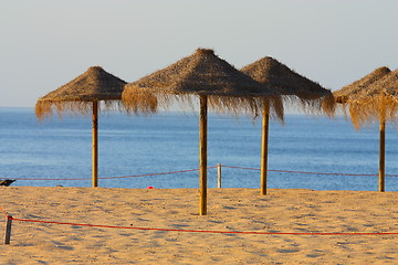 Image showing View of straw sunshades