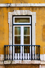 Image showing window in old yellow wall