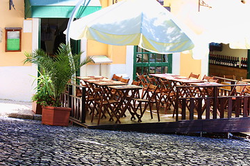 Image showing empty tables in street cafe