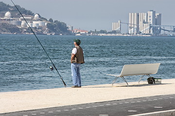 Image showing Man fishing in a river