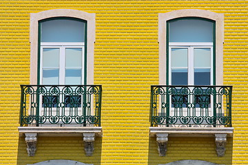 Image showing  two windows on orange vivid wall 