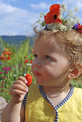 Image showing girl eating strawberries