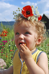 Image showing girl eating strawberries