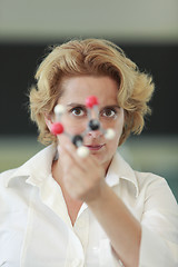 Image showing Female researcher analyzing a molecular structure
